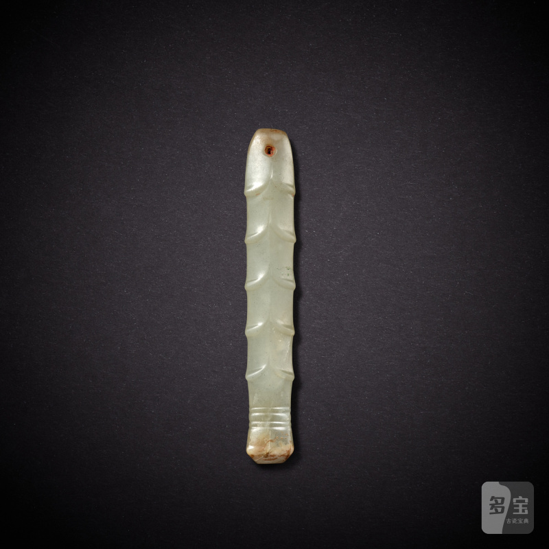 A pale celadon jade handle, Shang dynasty | 商 青玉柄形飾